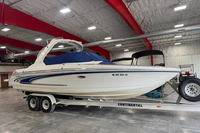 Slide: The Image of 2005 Formula 280 Bowrider boat on trailer in indoor storage facility. - 6