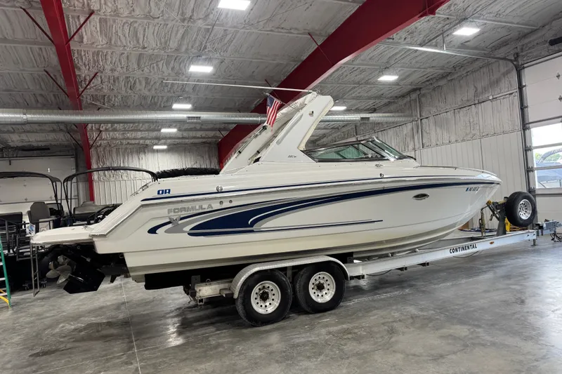 Slide: The Image of 2005 Formula 280 Bowrider boat on trailer in indoor storage facility. - 3