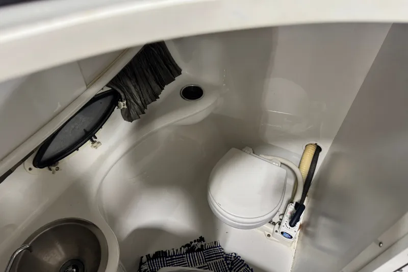 Slide: The Image of Interior of 2005 Formula 280 Bowrider boat bathroom with toilet and sink. - 20