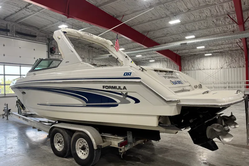 Slide: The Image of 2005 Formula 280 Bowrider boat on trailer in indoor storage facility. - 4