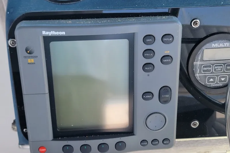Slide: The Image of Raytheon Pathfinder radar display on 1989 Sea Ray 270 Amberjack boat dashboard. - 13