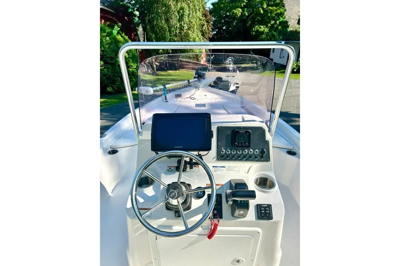 Slide: The Image of Center console of 2022 BLUEWAVE 2000 Classic boat with steering wheel and navigation equipment. - 8