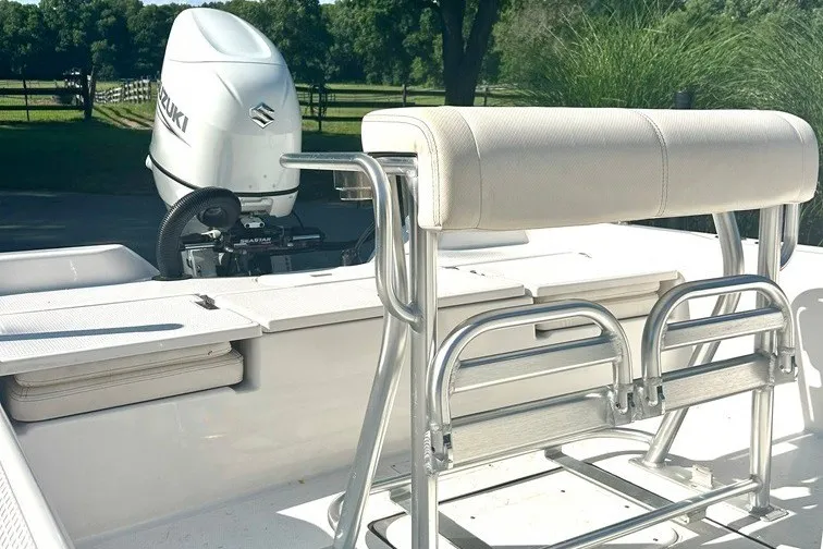 Slide: The Image of 2022 BLUEWAVE 2000 Classic boat with Suzuki outboard motor, featuring a sleek seating area. - 11