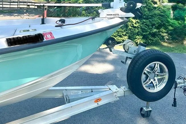 Slide: The Image of 2022 BLUEWAVE 2000 Classic boat on trailer, featuring Minn Kota motor. - 3
