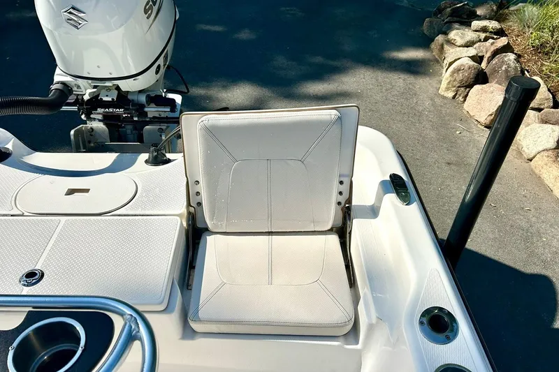 Slide: The Image of 2022 BLUEWAVE 2000 Classic boat seat and motor detail, featuring Suzuki engine. - 21