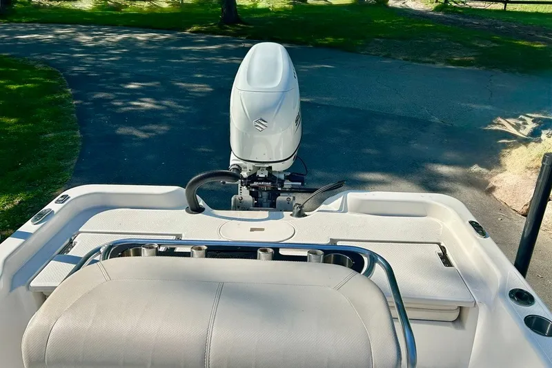 Slide: The Image of 2022 BLUEWAVE 2000 Classic boat with Suzuki outboard motor, parked on a driveway. - 15