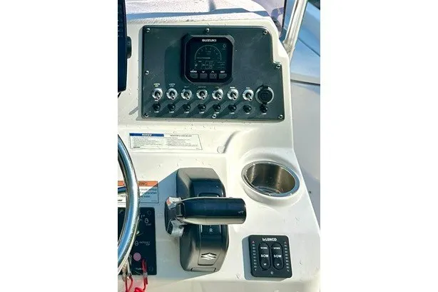 Slide: The Image of Control panel of 2022 BLUEWAVE 2000 Classic boat with steering wheel and throttle. - 10