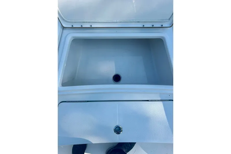Slide: The Image of Open storage compartment on 2022 BLUEWAVE 2000 Classic boat. - 18