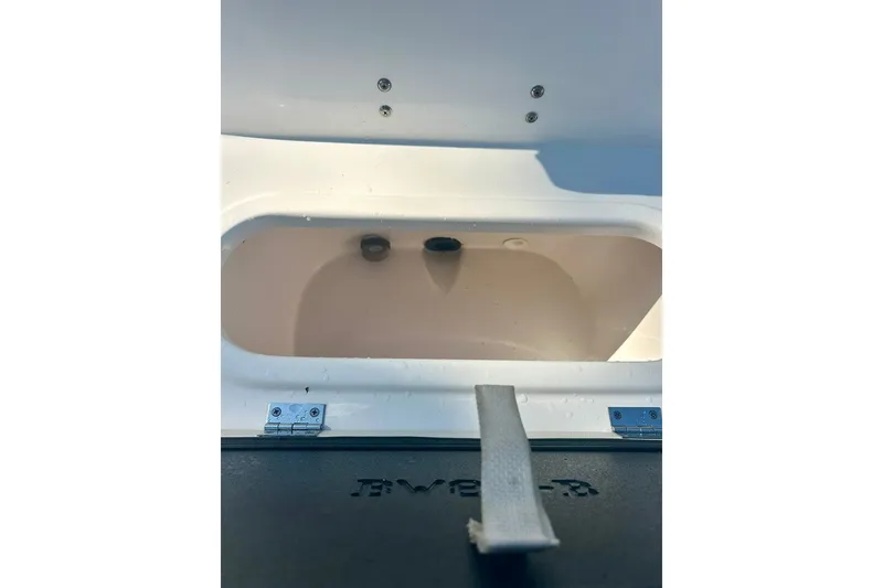 Slide: The Image of Livewell compartment of 2022 BLUEWAVE 2000 Classic boat, featuring a clean interior. - 19