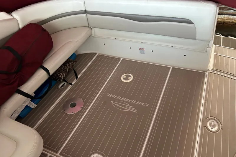 Slide: The Image of Interior of 2010 Chaparral Signature 370 boat with cushioned seating and branded flooring. - 18