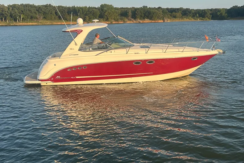 Slide: The Image of Chaparral Signature 370 boat from 2010 cruising on a serene lake. - 11