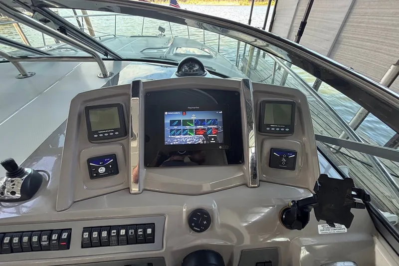 Slide: The Image of Helm of 2010 Chaparral Signature 370 boat with modern navigation controls and displays. - 24
