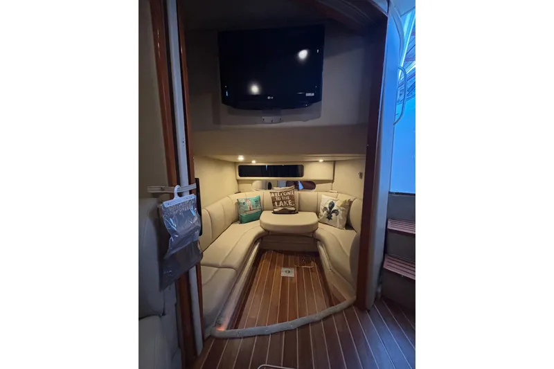 Slide: The Image of Interior of 2010 Chaparral Signature 370 yacht with cozy seating and mounted TV. - 27