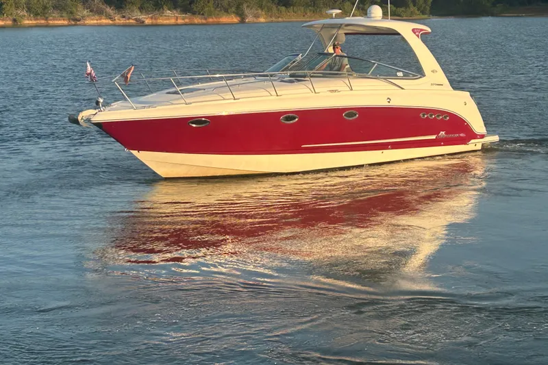 Slide: The Image of Chaparral Signature 370 boat from 2010 cruising on a serene lake. - 17