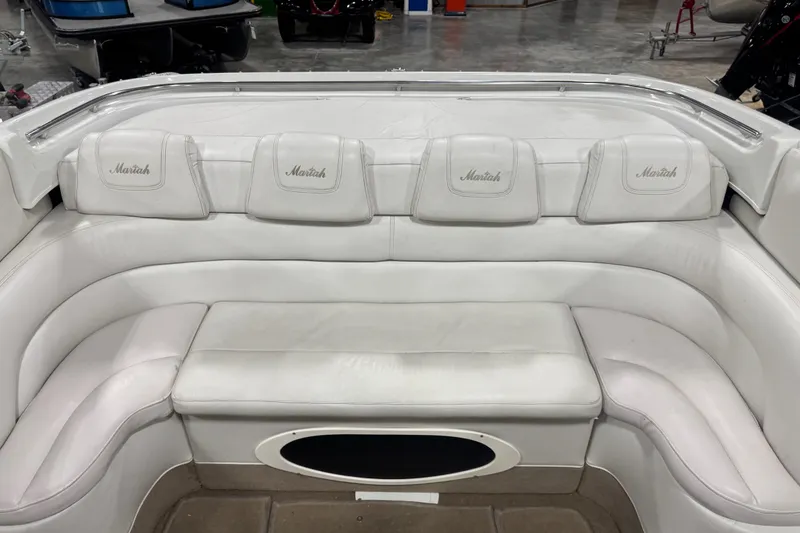 Slide: The Image of White leather seating in a 2000 Mariah 302 Shabah boat interior. - 6