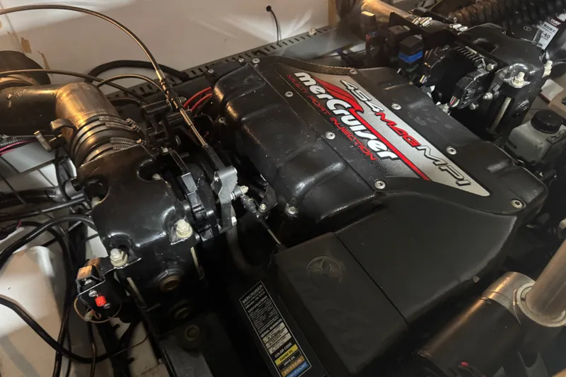 Slide: The Image of Engine of a 2000 Mariah 302 Shabah boat, featuring a MerCruiser 454 Mag MPI. - 14