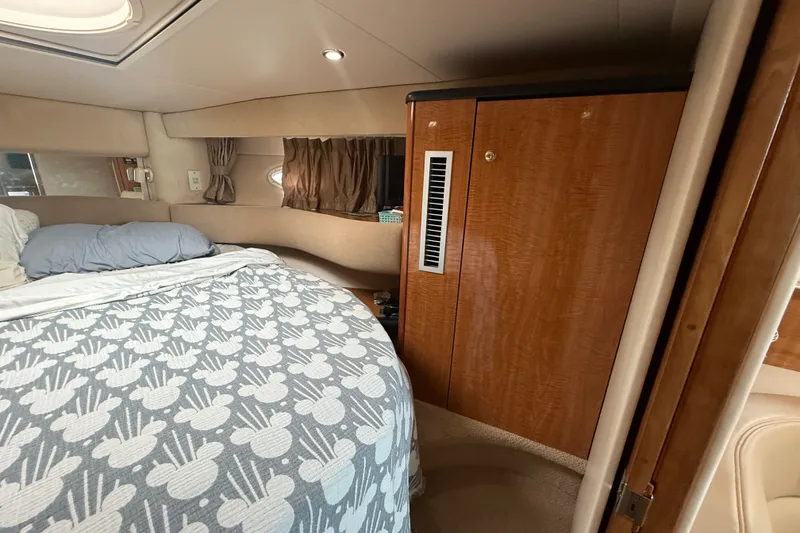 Slide: The Image of Interior cabin of 2003 Maxum 3700 SCR yacht with bed and wooden cabinetry. - 41