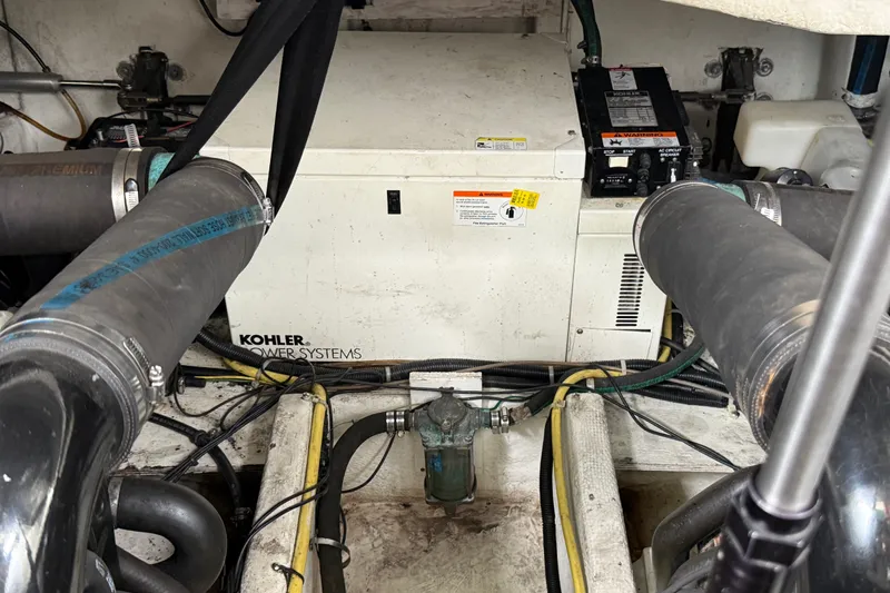 Slide: The Image of Engine compartment of a 2003 Maxum 3700 SCR with Kohler power systems. - 56