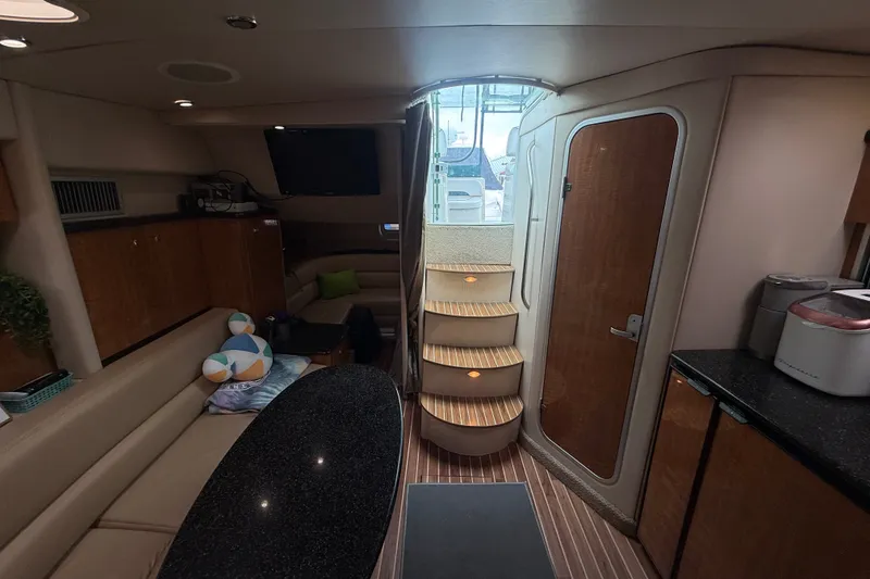 Slide: The Image of Interior of 2003 Maxum 3700 SCR yacht with cozy seating and modern amenities. - 34