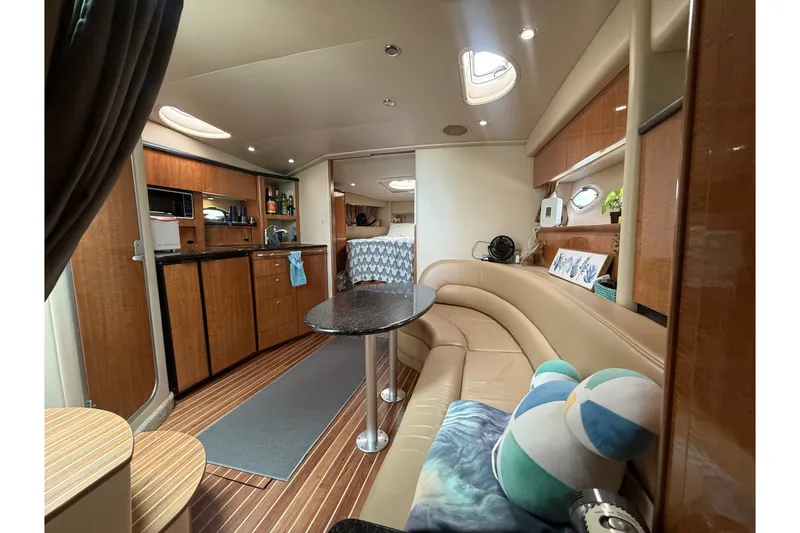 Slide: The Image of Luxurious interior of 2003 Maxum 3700 SCR yacht with modern amenities and cozy seating. - 48