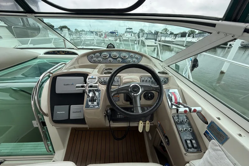 Slide: The Image of Cockpit view of 2003 Maxum 3700 SCR yacht with Garmin navigation system. - 23