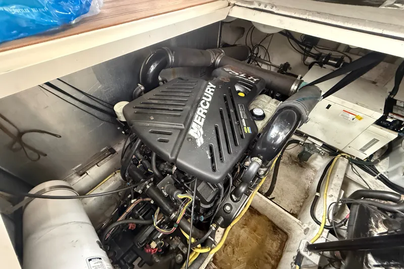 Slide: The Image of Engine compartment of a 2003 Maxum 3700 SCR boat with Mercury engine. - 54