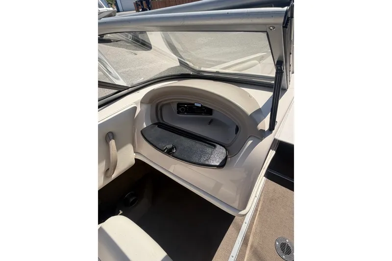 Slide: The Image of 2007 Reinell 204 Fish & Ski boat interior with open glove compartment. - 35