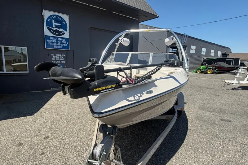Slide: The Image of 2007 Reinell 204 Fish & Ski boat on trailer at marine dealership. - 10