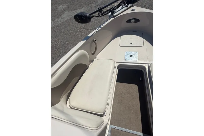 Slide: The Image of 2007 Reinell 204 Fish & Ski boat interior with seating and storage compartments. - 25