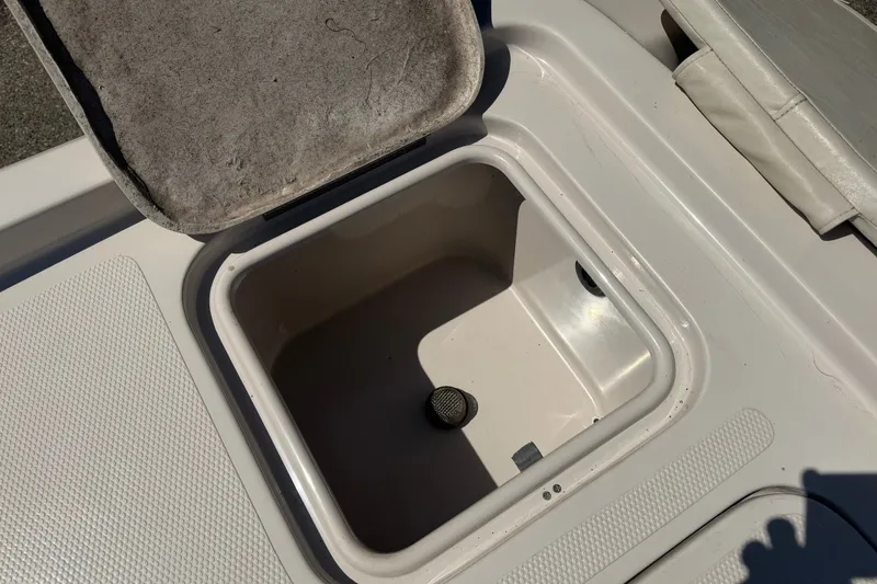 Slide: The Image of Open storage compartment on a 2007 Reinell 204 Fish & Ski boat. - 44