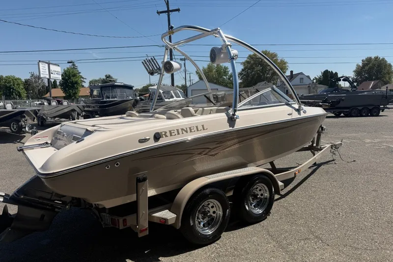 Slide: The Image of 2007 Reinell 204 Fish & Ski boat on trailer in outdoor dealership lot. - 6