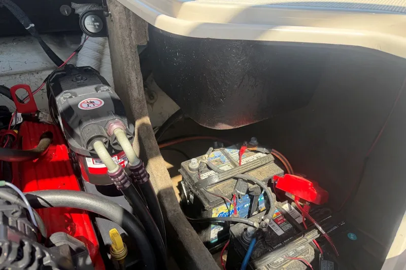 Slide: The Image of Engine compartment of a 2007 Reinell 204 Fish & Ski boat, showing battery and wiring. - 42