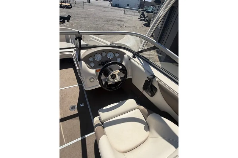 Slide: The Image of 2007 Reinell 204 Fish & Ski boat interior with steering wheel and dashboard controls. - 22