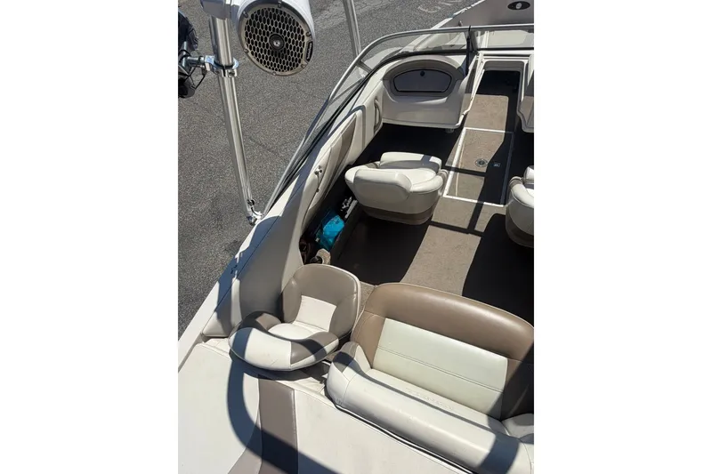 Slide: The Image of 2007 Reinell 204 Fish & Ski boat interior with beige seating and speaker system. - 18