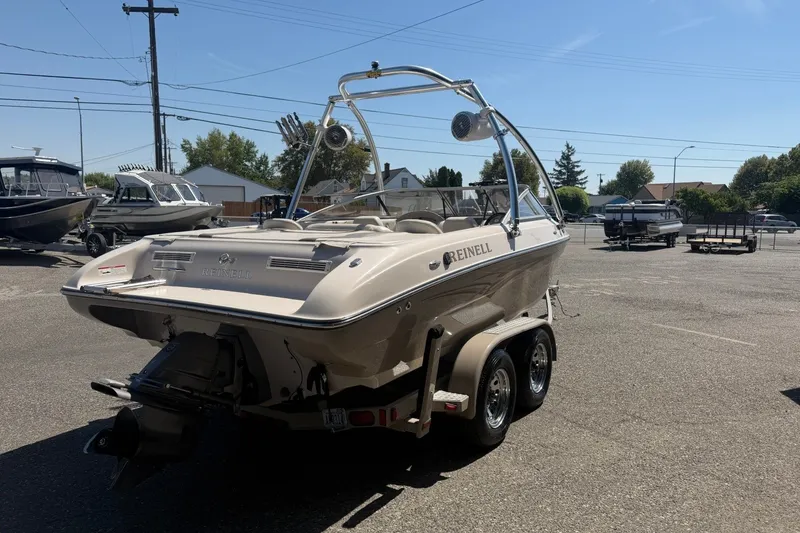 Slide: The Image of 2007 Reinell 204 Fish & Ski boat on trailer in parking lot. - 5