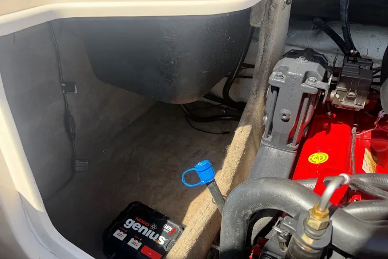 Slide: The Image of Engine compartment of a 2007 Reinell 204 Fish & Ski boat with NOCO Genius battery. - 43