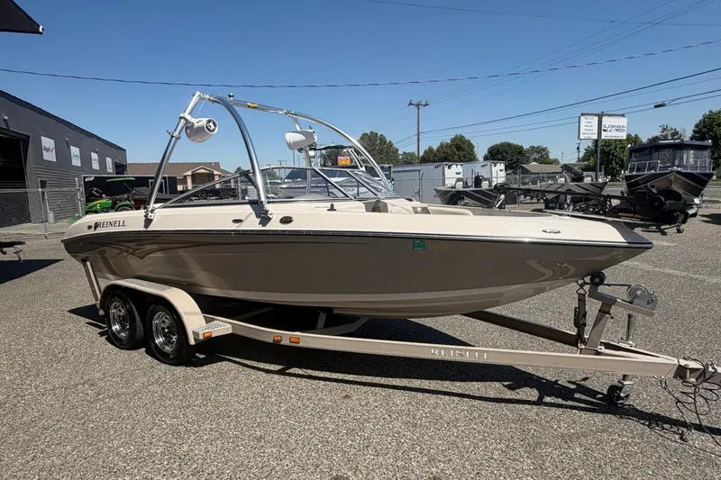 Slide: The Image of 2007 Reinell 204 Fish & Ski boat on trailer in outdoor dealership lot. - 8