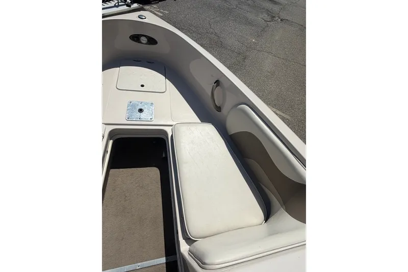 Slide: The Image of 2007 Reinell 204 Fish & Ski boat interior with seating and storage compartments. - 26