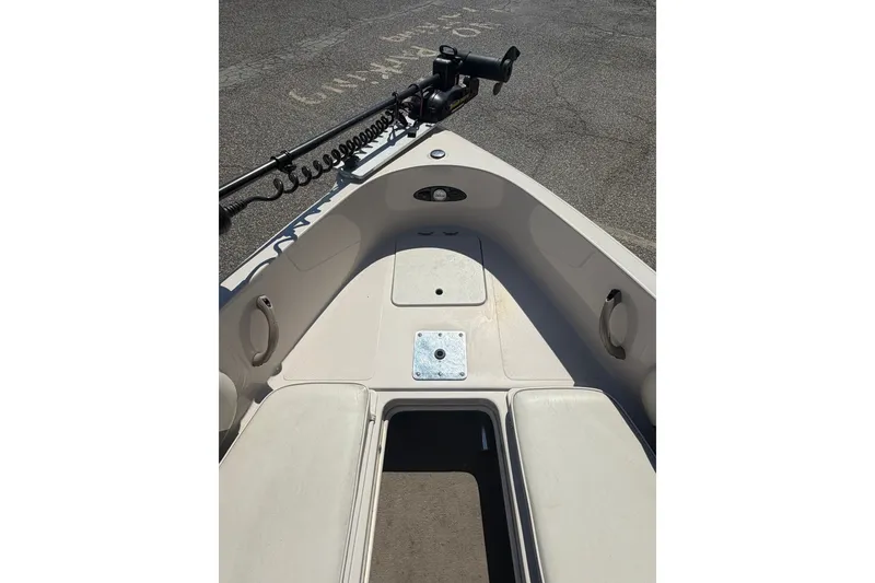 Slide: The Image of 2007 Reinell 204 Fish & Ski boat interior with seating and storage compartments. - 24