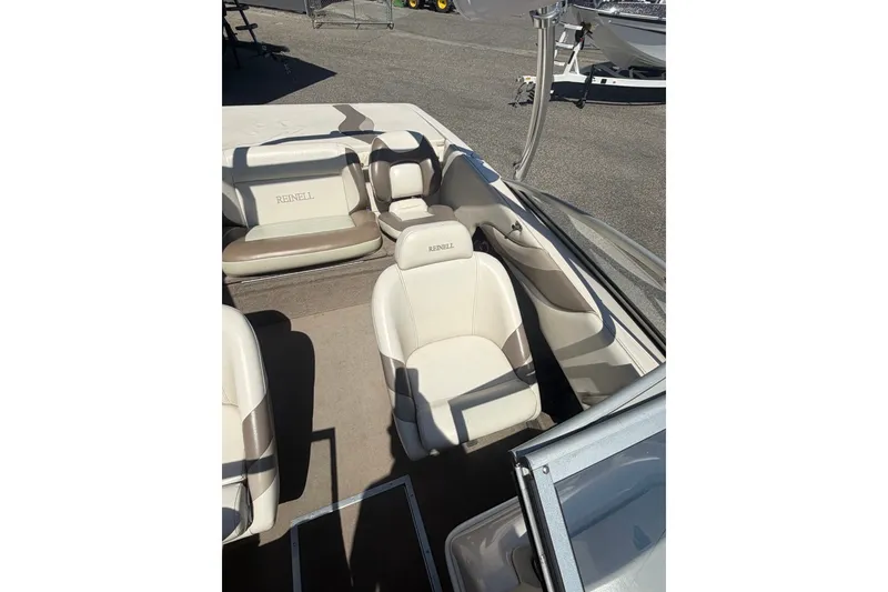 Slide: The Image of 2007 Reinell 204 Fish & Ski boat interior with beige seating and open deck. - 32