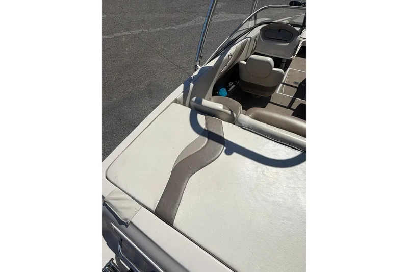 Slide: The Image of 2007 Reinell 204 Fish & Ski boat interior with beige seating and sleek design. - 14