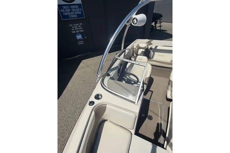 Slide: The Image of 2007 Reinell 204 Fish & Ski boat interior with steering wheel and seating. - 30
