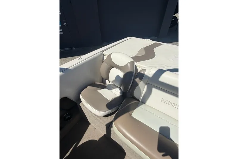 Slide: The Image of 2007 Reinell 204 Fish & Ski boat interior with beige and white seating. - 37