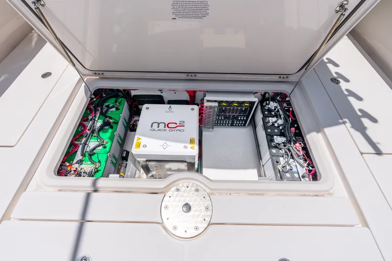Slide: The Image of 2024 Solace 41CS boat engine compartment with Quick Gyro stabilizer and battery setup. - 32