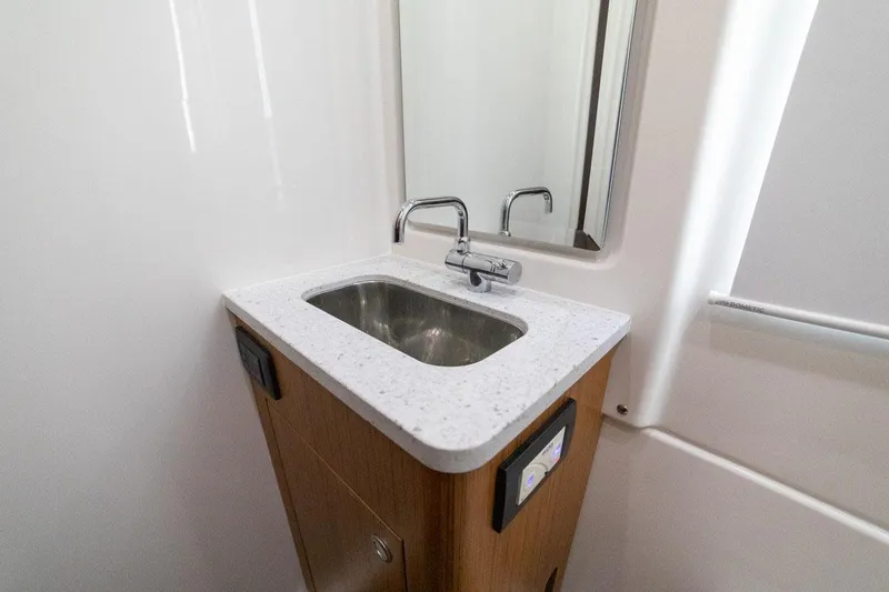 Slide: The Image of Manufacturer Provided Image: 2024 Solace 41 CS bathroom sink with modern faucet and mirror - 50