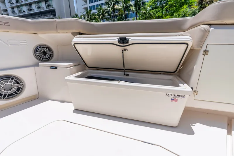 Slide: The Image of 2024 Solace 41CS boat interior with open storage compartment and speakers. - 39