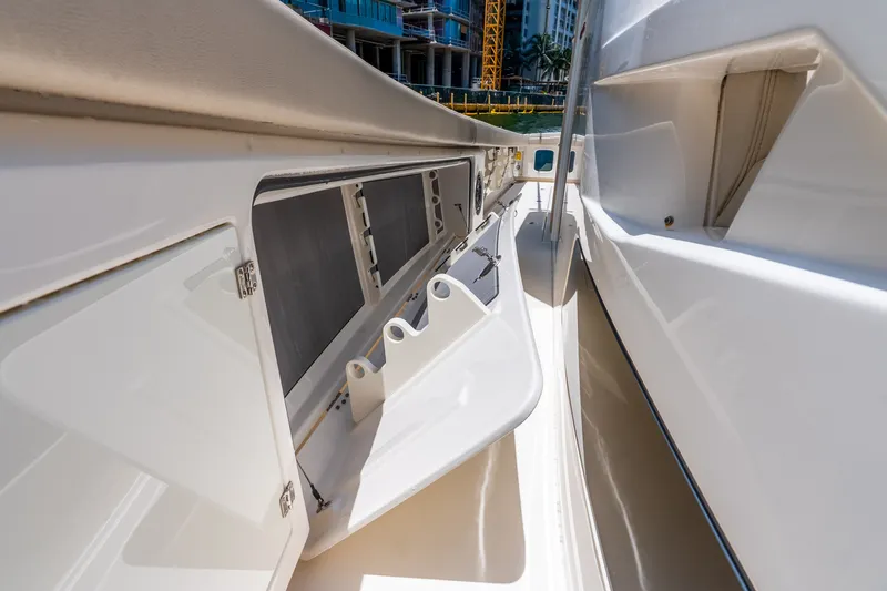 Slide: The Image of 2024 Solace 41CS boat deck with open storage compartment, showcasing sleek design. - 42