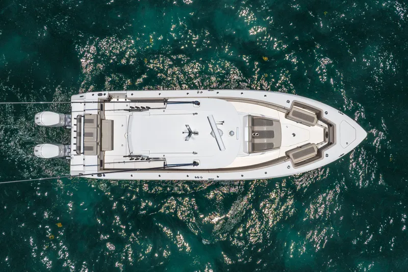 Slide: The Image of Overhead view of 2024 Solace 41CS boat on sparkling blue water. - 16