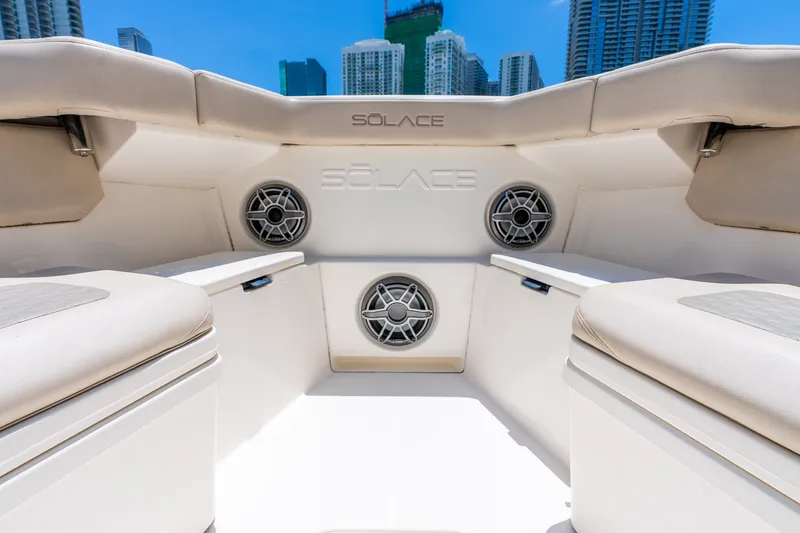 Slide: The Image of Interior view of 2024 Solace 41CS boat with cushioned seating and speakers. - 37