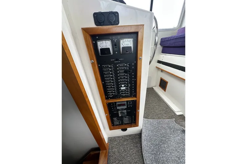 Slide: The Image of Electrical panel of a 2001 Northern Bay 36 boat, featuring gauges and switches. - 20